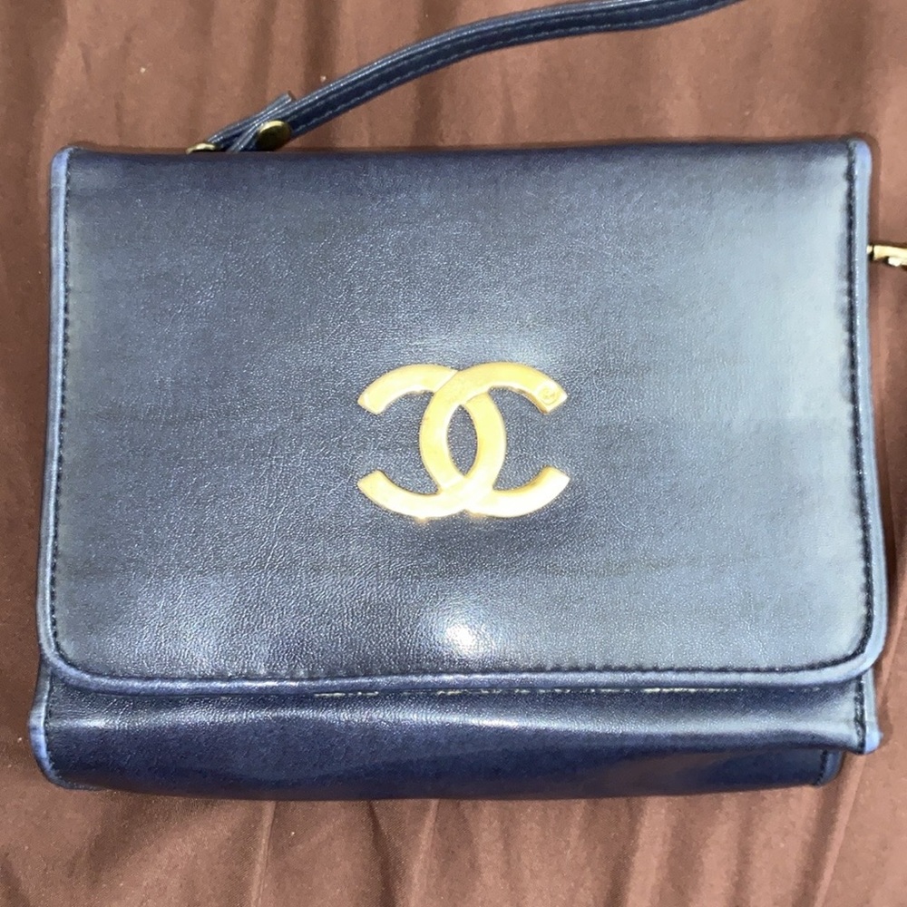 INSPIRED Dark Blue and Gold Clutch with Iconic Logo